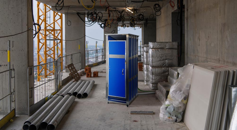 Skycrapper Portable Restroom | The Skycrapper Portable Toilet at a High Rise Building Construction Site.