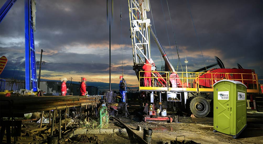 Eye Wash Station | Eye Wash Station at a Construction Site with Crane at Night