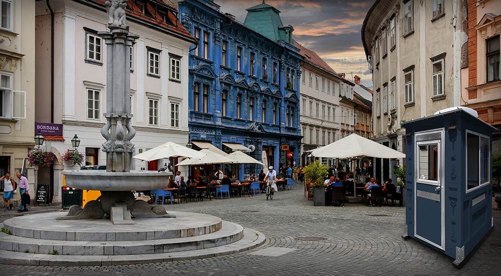 Valet Key Booth 16 | Valet Key Booth 16 on a cobblestone street in front of restaurants.