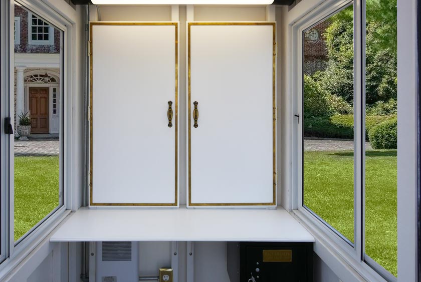 TWO INTERIOR CABINETS WITH BRASS TRIM