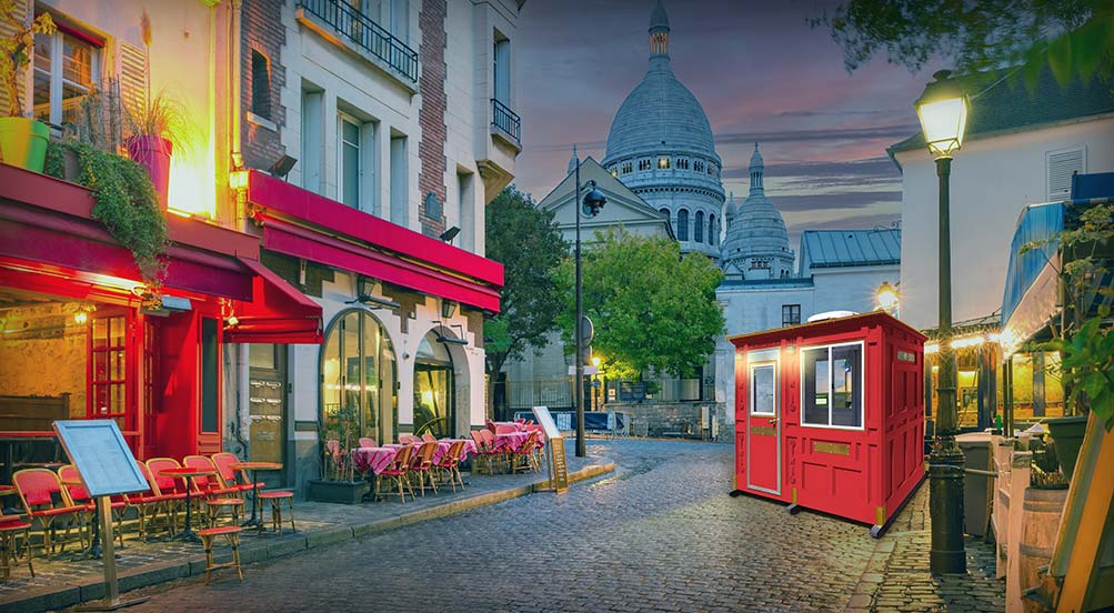 Valet Key Booth 32 | Valet Key Booth 32 on a cobblestone street in front of restaurants.