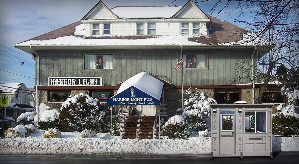 Valet Key Booth 32 | Valet Key Booth 32 in front of a pub in winter in New York.