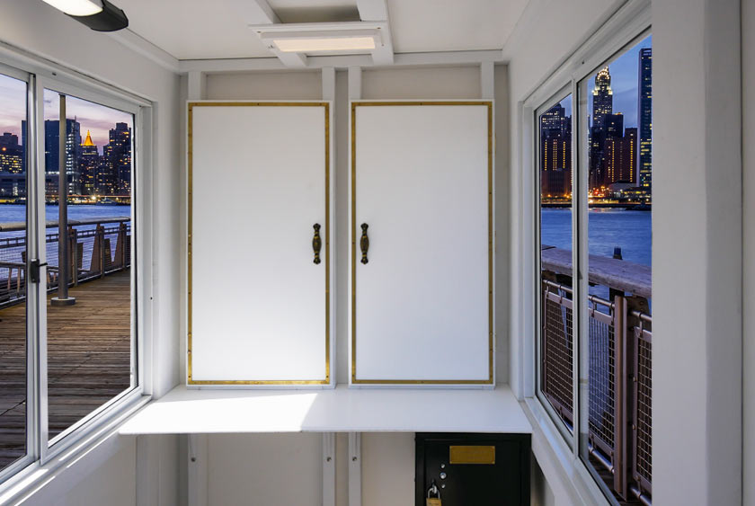 TWO INTERIOR CABINETS WITH BRASS TRIM