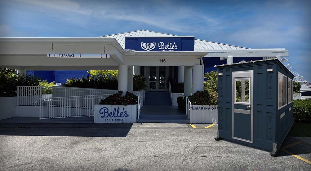 A Blue Valet Key Booth 48 in Front of a Marina Restaurant