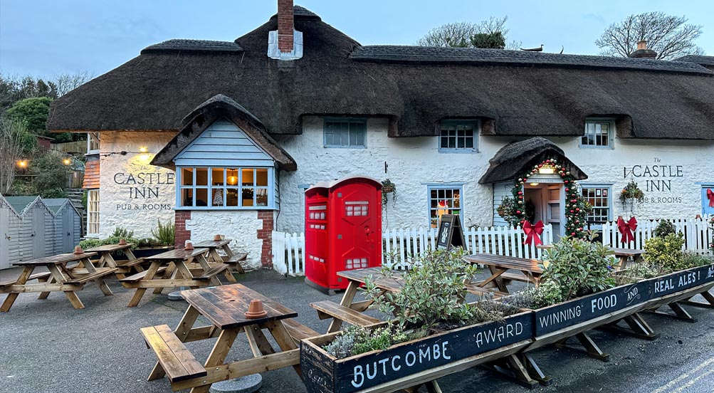 Portaloo Portable Toilet | The Portaloo Portable Toilet in Front of a Rustic Pub